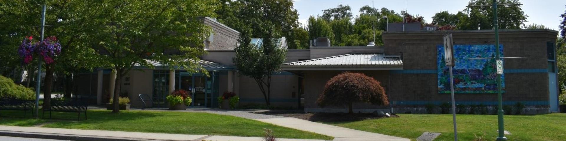 Side of Pitt Meadows City Hall with green grass