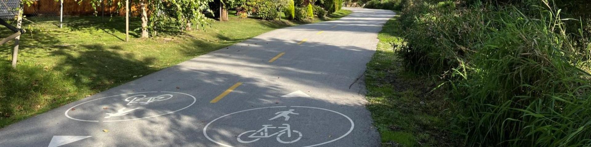 markings on a multi-use path identifying directions pedestrians and cyclists should be going