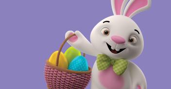 easter bunny holding basket of eggs